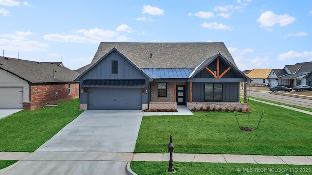 view of front of house featuring board and batten siding, a standing seam roof, and a front lawn