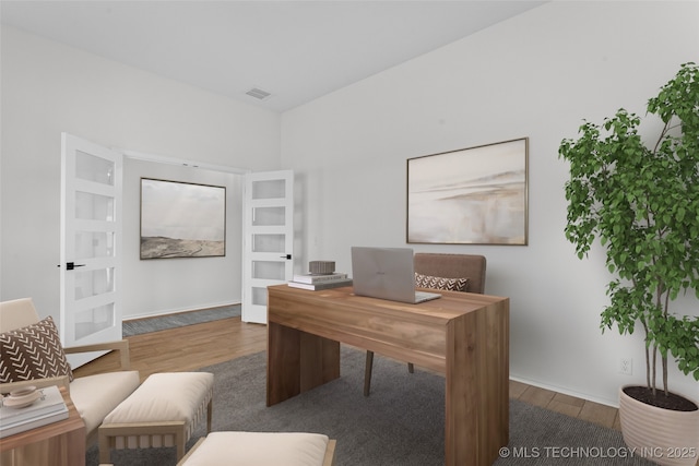 office area featuring dark wood-style floors and visible vents