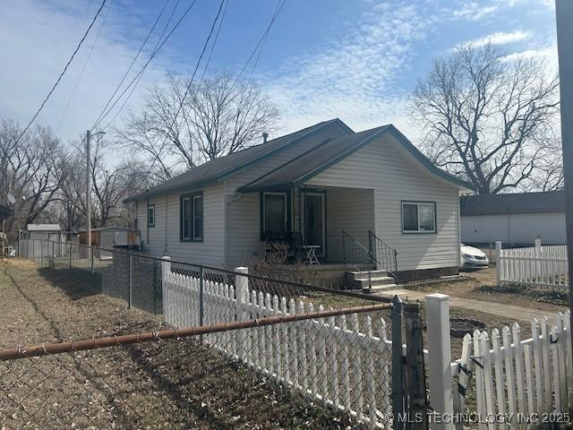 bungalow with a fenced front yard