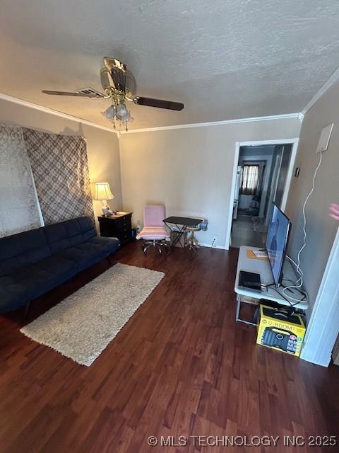 111 N 47th W Ave, Tulsa, OK 74127 - living room with ceiling fan, ornamental molding, dark wood finished floors, and a textured ceiling