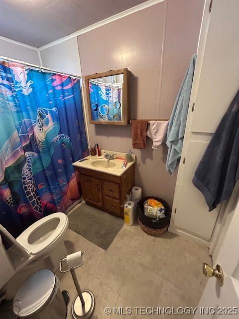 111 N 47th W Ave, Tulsa, OK 74127 - bathroom featuring toilet, a shower with curtain, tile patterned flooring, and vanity