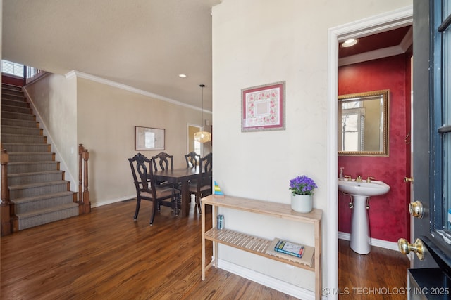 interior space featuring crown molding, recessed lighting, stairway, wood finished floors, and baseboards