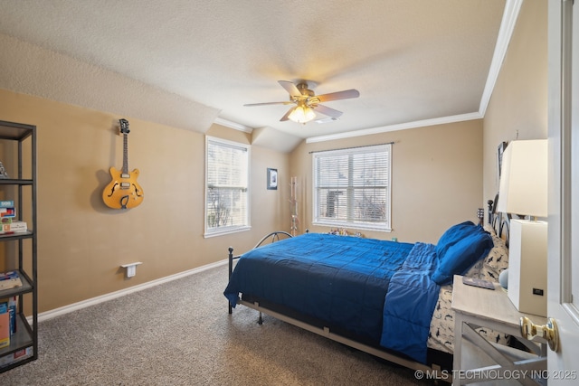 bedroom with baseboards, ornamental molding, a ceiling fan, a textured ceiling, and carpet floors
