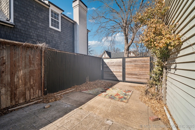 exterior space with a fenced backyard and a patio