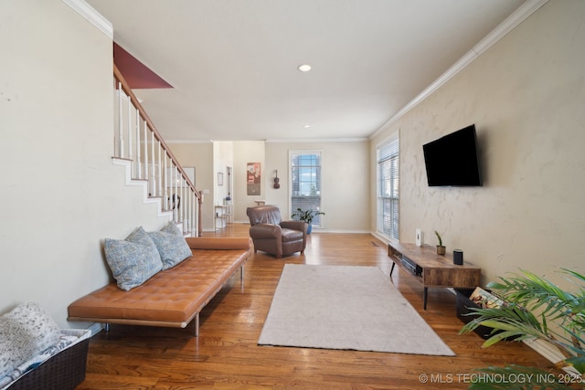 living area with baseboards, recessed lighting, stairway, crown molding, and wood finished floors