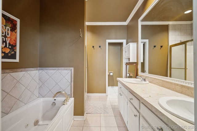 full bathroom with a tub with jets, ornamental molding, a sink, and tile patterned floors