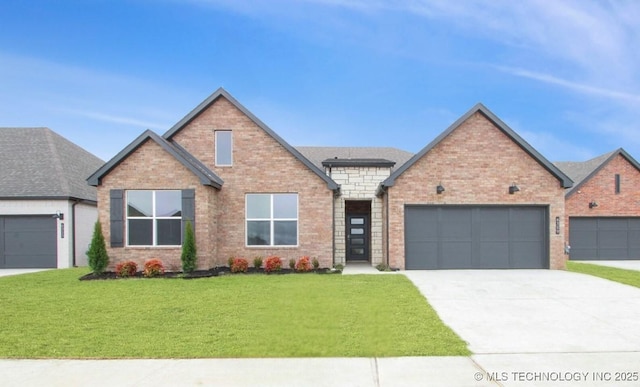 view of front of property with a garage, a front yard, brick siding, and driveway