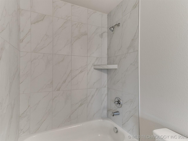 bathroom featuring  shower combination, a textured wall, and toilet