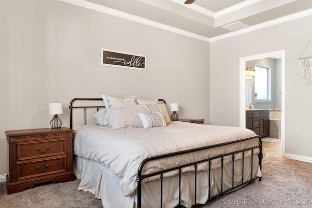 bedroom featuring connected bathroom, light carpet, crown molding, and baseboards