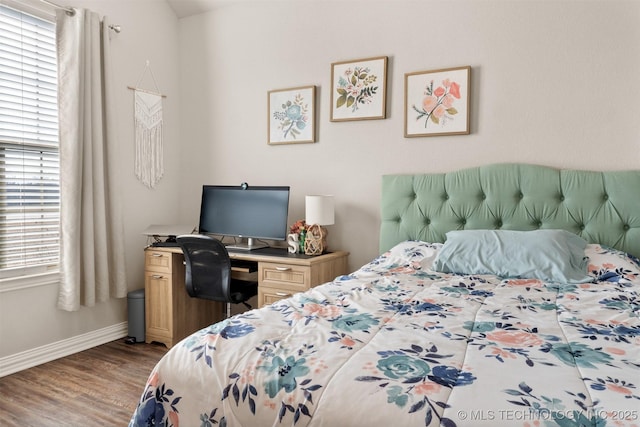 bedroom with baseboards and light wood-style floors