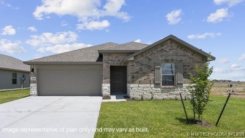 view of front of property with driveway, a front lawn, an attached garage, and brick siding