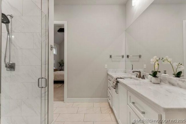 11904 S Toledo Ave, Tulsa, OK 74137 - ensuite bathroom featuring a stall shower, baseboards, ensuite bath, marble finish floor, and vanity