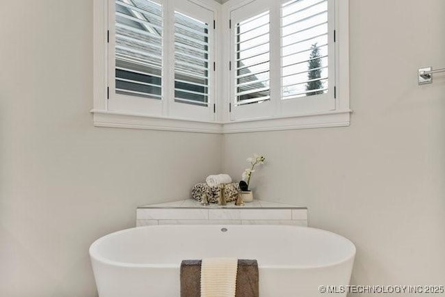 11904 S Toledo Ave, Tulsa, OK 74137 - bathroom with a freestanding tub
