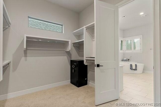 11904 S Toledo Ave, Tulsa, OK 74137 - spacious closet featuring light colored carpet