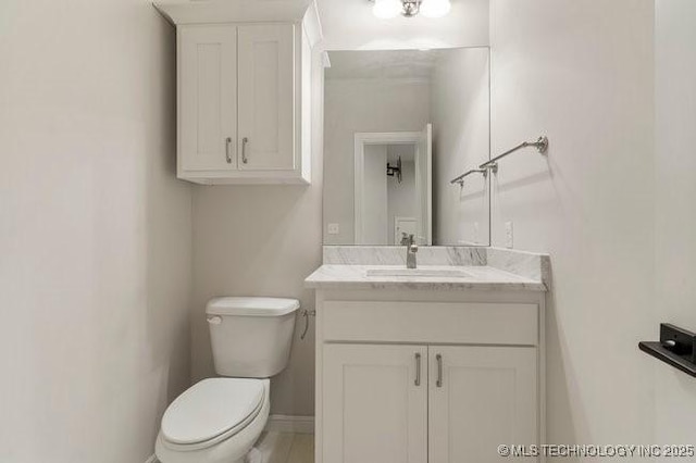 11904 S Toledo Ave, Tulsa, OK 74137 - half bath featuring toilet, baseboards, and vanity