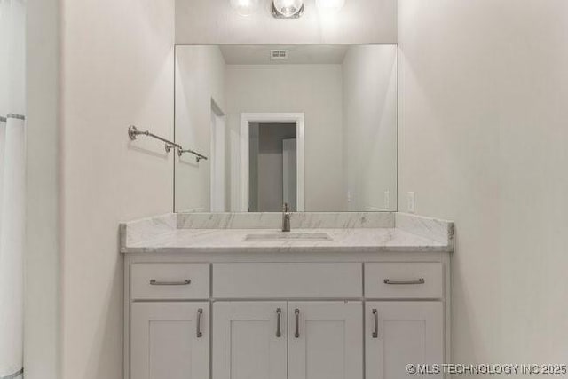 11904 S Toledo Ave, Tulsa, OK 74137 - bathroom featuring visible vents and vanity