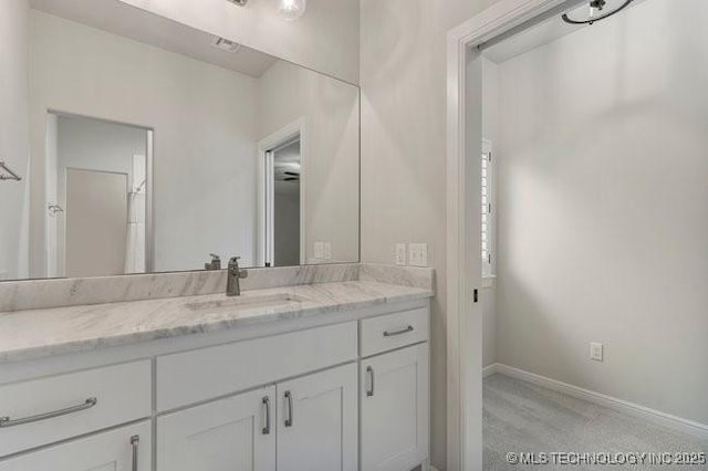 11904 S Toledo Ave, Tulsa, OK 74137 - bathroom with vanity and baseboards