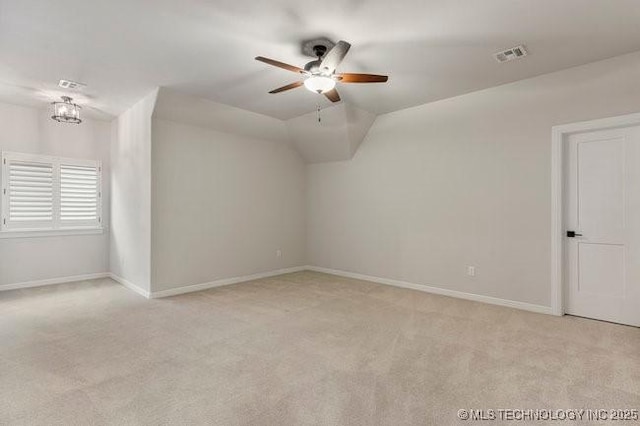 11904 S Toledo Ave, Tulsa, OK 74137 - spare room featuring baseboards, visible vents, a ceiling fan, light colored carpet, and lofted ceiling