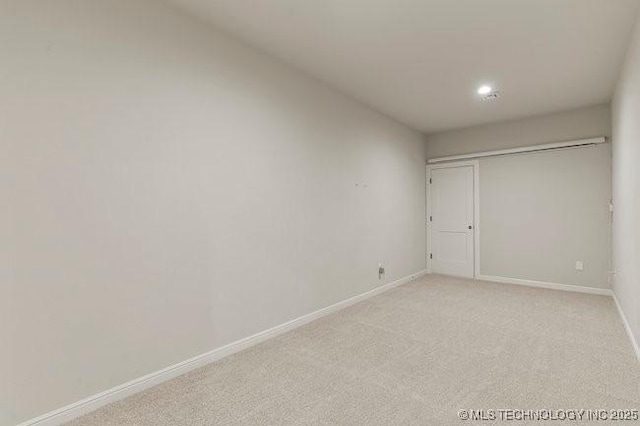 11904 S Toledo Ave, Tulsa, OK 74137 - unfurnished bedroom with light carpet and baseboards