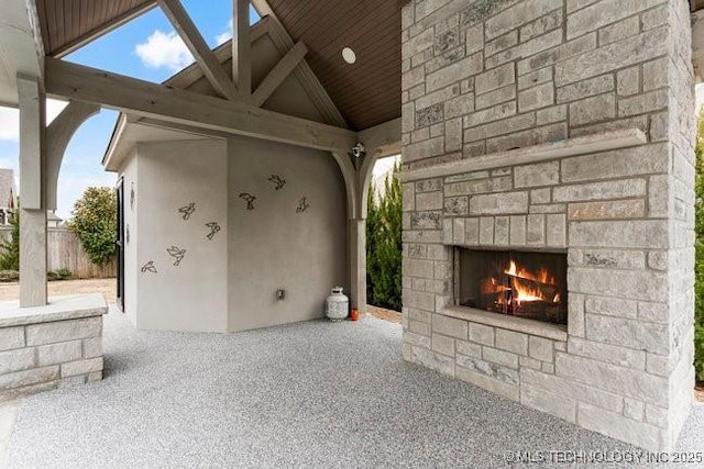 11904 S Toledo Ave, Tulsa, OK 74137 - view of patio with an outdoor stone fireplace