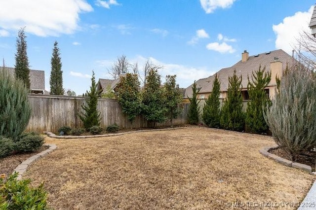 11904 S Toledo Ave, Tulsa, OK 74137 - view of yard featuring a fenced backyard