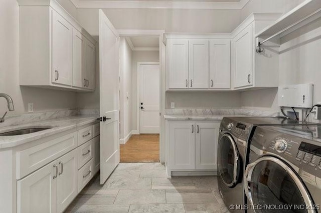11904 S Toledo Ave, Tulsa, OK 74137 - clothes washing area featuring ornamental molding, independent washer and dryer, a sink, and cabinet space