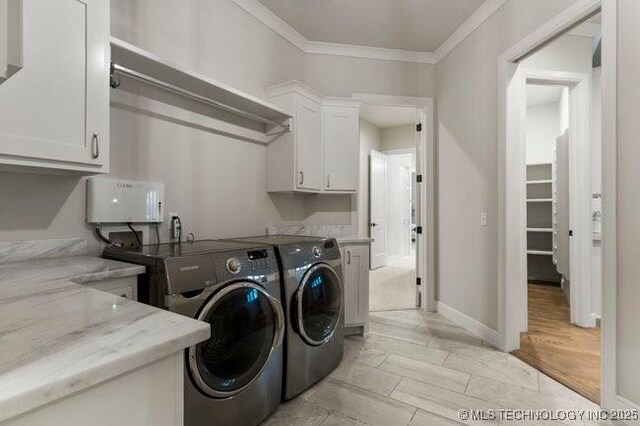 11904 S Toledo Ave, Tulsa, OK 74137 - washroom with cabinet space, light wood-style flooring, ornamental molding, separate washer and dryer, and baseboards