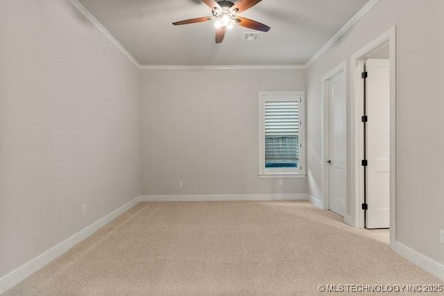 11904 S Toledo Ave, Tulsa, OK 74137 - spare room featuring light carpet, visible vents, baseboards, a ceiling fan, and crown molding