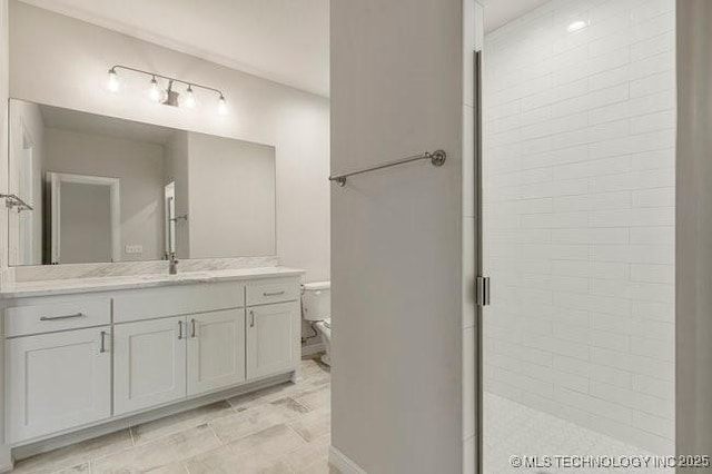 11904 S Toledo Ave, Tulsa, OK 74137 - full bathroom featuring toilet, tiled shower, and vanity
