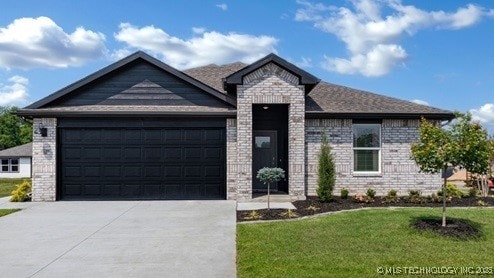 view of front of home with a garage, brick siding, driveway, and a front lawn