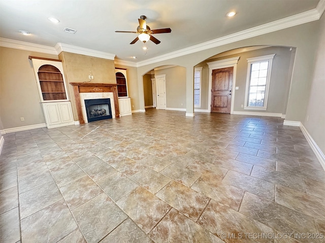 unfurnished living room with a high end fireplace, visible vents, and baseboards