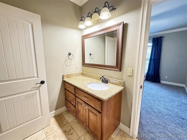 bathroom featuring baseboards, ornamental molding, tile patterned flooring, and vanity