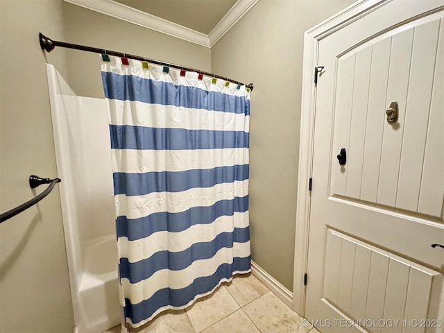 bathroom with curtained shower, baseboards, ornamental molding, and tile patterned floors