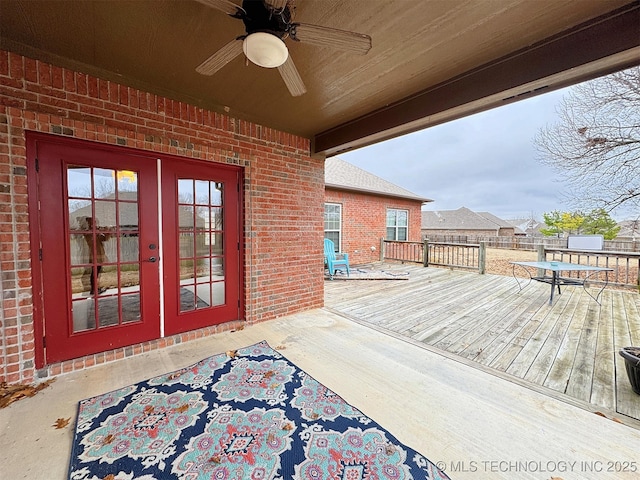 deck featuring french doors and ceiling fan