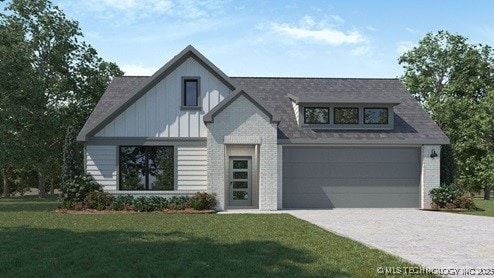 view of front of home with driveway, brick siding, an attached garage, and a front yard