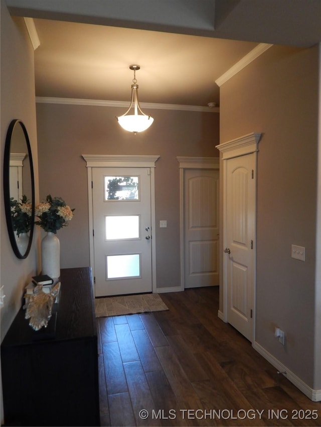 entryway featuring baseboards, ornamental molding, and dark wood-style flooring