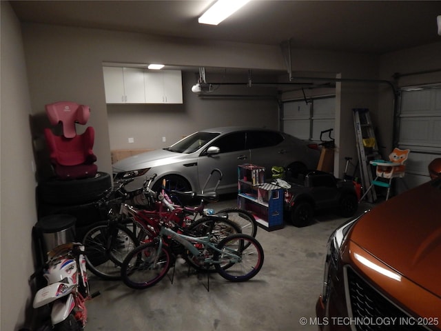 garage featuring bike storage and a garage door opener