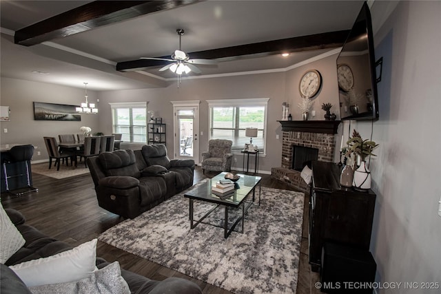 190 N Castle St, Skiatook, OK 74070 - living area featuring beam ceiling, dark wood finished floors, plenty of natural light, ceiling fan, and a brick fireplace