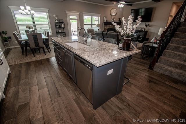 190 N Castle St, Skiatook, OK 74070 - kitchen featuring open floor plan, dishwasher, dark wood-style flooring, a chandelier, and a fireplace