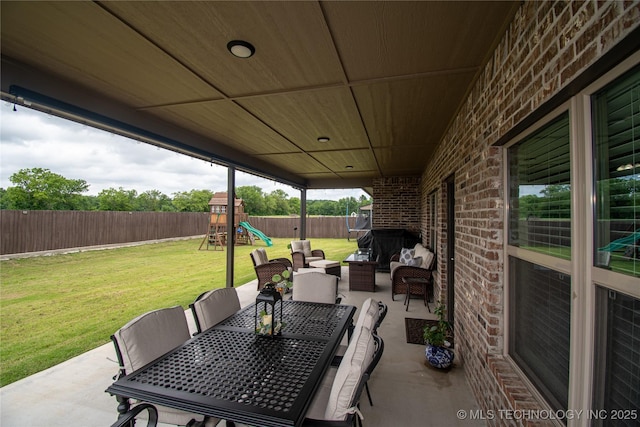 190 N Castle St, Skiatook, OK 74070 - fenced backyard with a patio, a playground, outdoor dining space, and an outdoor living space