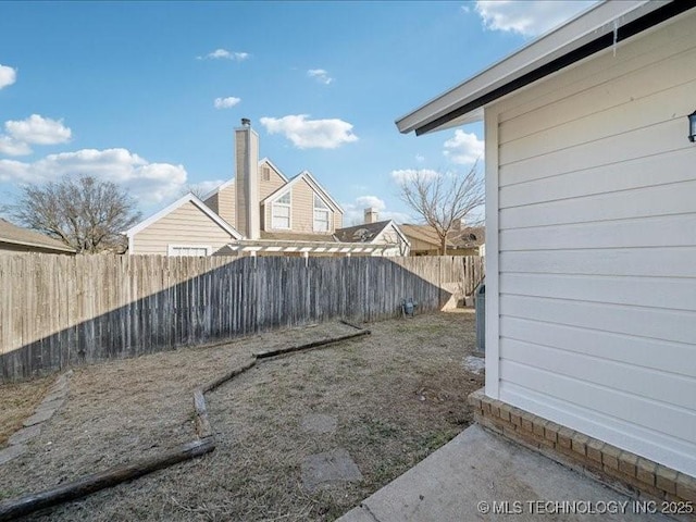 view of yard with a fenced backyard