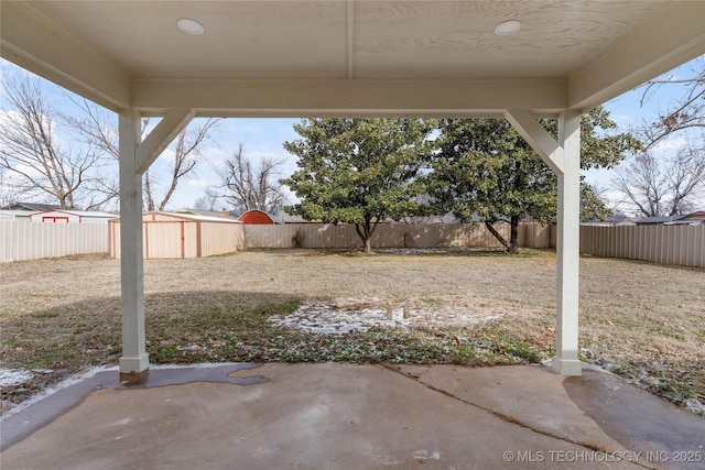 view of yard featuring a patio area and a fenced backyard