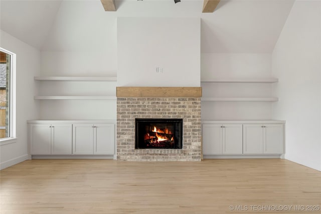 2038 E 129th St, Jenks, OK 74037 - unfurnished living room with light wood-style floors, a brick fireplace, and lofted ceiling