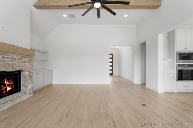 2038 E 129th St, Jenks, OK 74037 - unfurnished living room with ceiling fan, a fireplace, high vaulted ceiling, and light wood-style floors