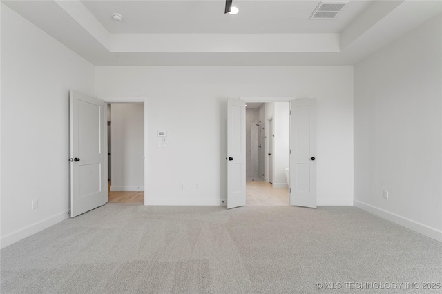 2038 E 129th St, Jenks, OK 74037 - unfurnished bedroom with a raised ceiling and light colored carpet