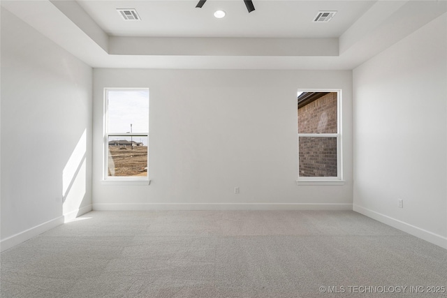 2038 E 129th St, Jenks, OK 74037 - empty room featuring a raised ceiling, carpet, and a ceiling fan