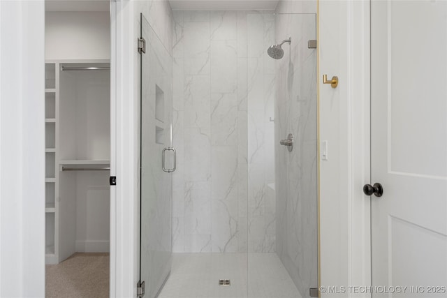 2038 E 129th St, Jenks, OK 74037 - bathroom featuring a marble finish shower and a walk in closet