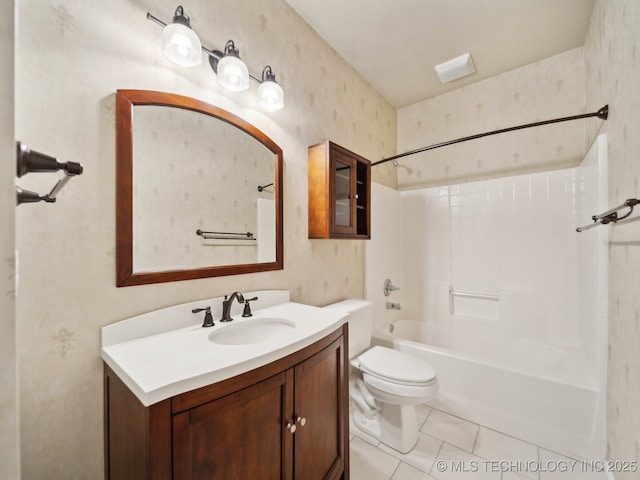 bathroom with tile patterned flooring, bathing tub / shower combination, toilet, and vanity