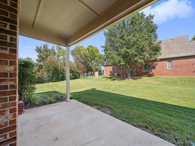 view of patio featuring fence