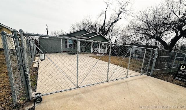 view of gate featuring fence